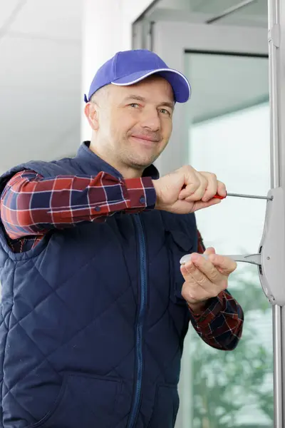 Man Screwing Repairing Door Handle — Stock Photo, Image