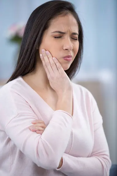 stock image beautiful sad unhappy woman feel pain on her teeth