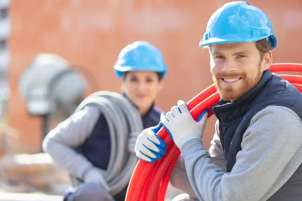 Male Female Builders Posing Construction Site — Stock Photo, Image