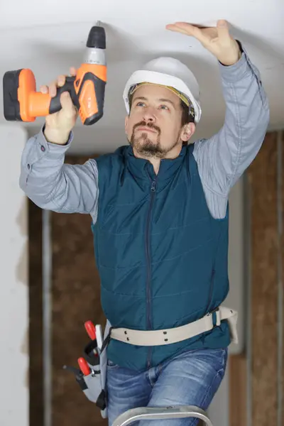 Young Man Fixing Drywall Suspended Ceiling — Stock Photo, Image
