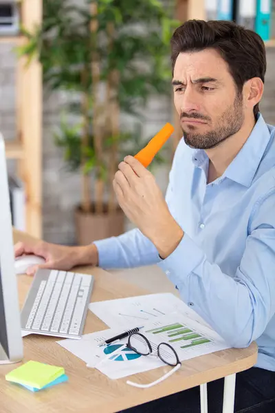 Young Man Blue Shirt Eating Raw Carrot — Stock Photo, Image