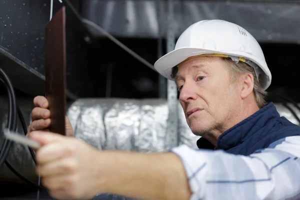 Male Senior Worker Builder Helmet Working Ceiling — Stock Photo, Image