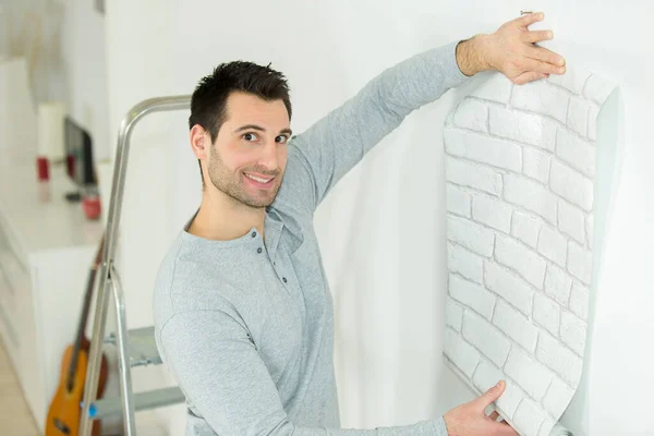 Man Posing While Holding Wallpaper Wall — Stock Photo, Image