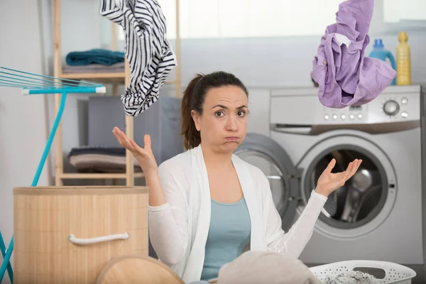 Frustrated Woman Throwing Laundry Air — Stock Photo, Image