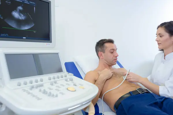 Female Doctor Using Sonogram Male Patients Chest — Stock Photo, Image
