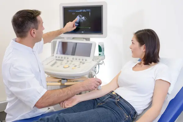 woman having right arm ultrasound