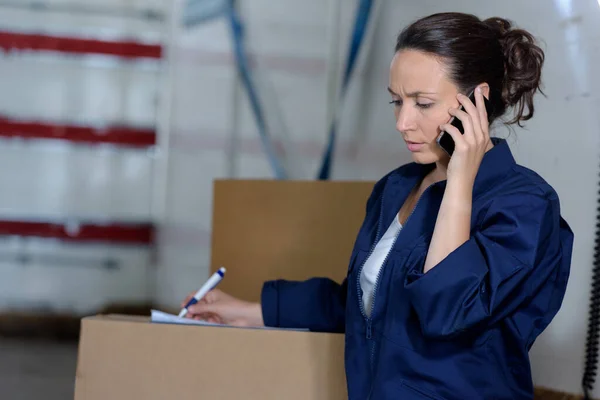 Female Warehouse Worker Checking Delivering Boxes — Stock Photo, Image