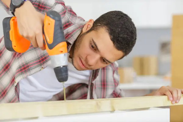 Man Drilling Wood Cordless Drill Table — Stock Photo, Image