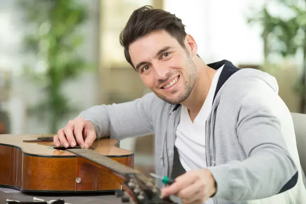 Happy Man Has Fixed Guitar Top — Stock Photo, Image