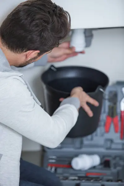plumber repairing an hot-water heater