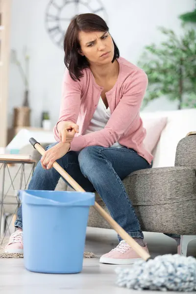 Reluctant Woman Sofa Pointing Bucket — Stock Photo, Image