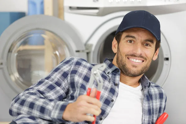 Smiling Plumber Repairing Washing Machine — Stock Photo, Image