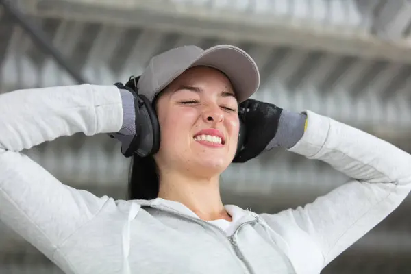 Expressive Woman Holding Her Hands Her Ear Defenders — Stock Photo, Image