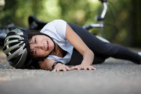 sad woman fell of her bike