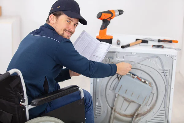 Disabled Young Man Wheelchair Repairing Washing Machine — Stock Photo, Image