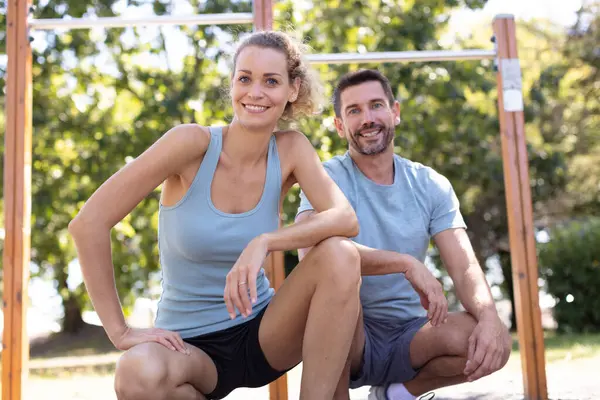 cheerful caucasian couple fitness outdoors