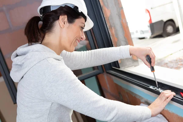 Woman Installing Window Screwdriver — Stock Photo, Image