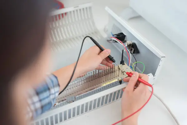 Multimeter Probes Testing Heater Element — Stock Photo, Image