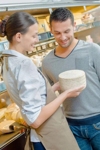 Woman Advising Man Cheese — Stock Photo, Image