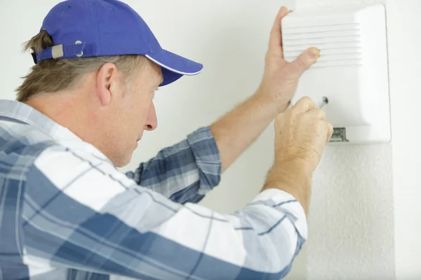Mature Electrician Installing Alarm System — Stock Photo, Image