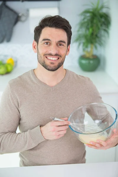 stock image closeup on man whisking eggs in bowl