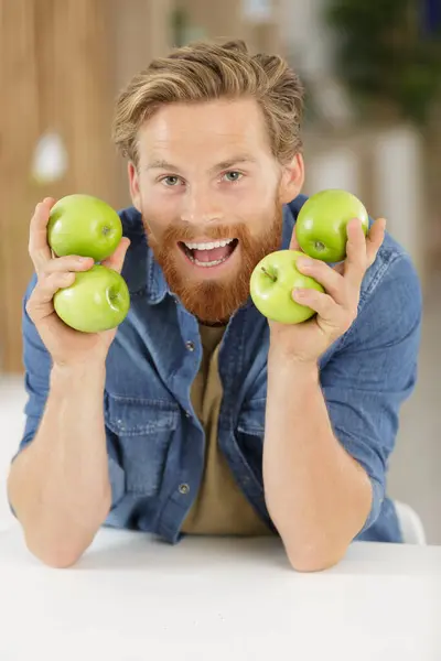 Smiling Young Man Holding Green Apples — Stock Photo, Image