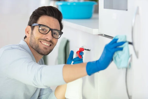 Handsome Young Man Wiping Kitchen — Stock Photo, Image
