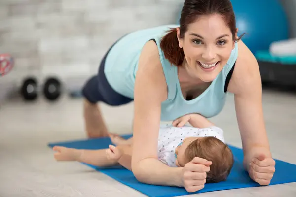 Young Mother Does Physical Yoga Exercises Together Her Baby — Stock Photo, Image