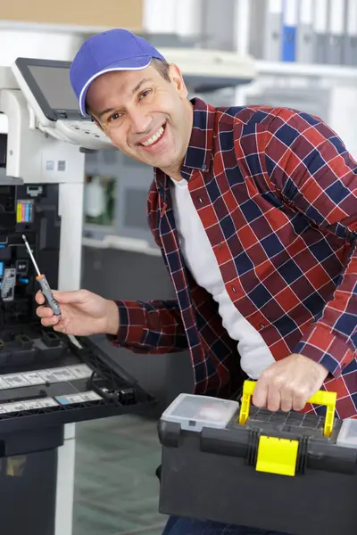 portrait of a mature photocopier maintenance man