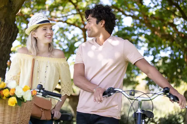 couple celebrating their love at the park with bicycle