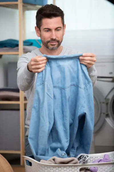 man at a laundry room