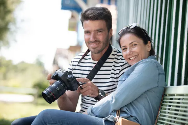 Couple Tourists Reviewing Photos Dslr Camera Stock Image