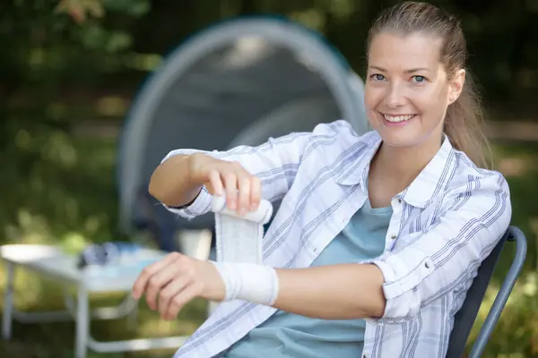 Woman Applying Arm Bandage Her Arm — Stock Photo, Image