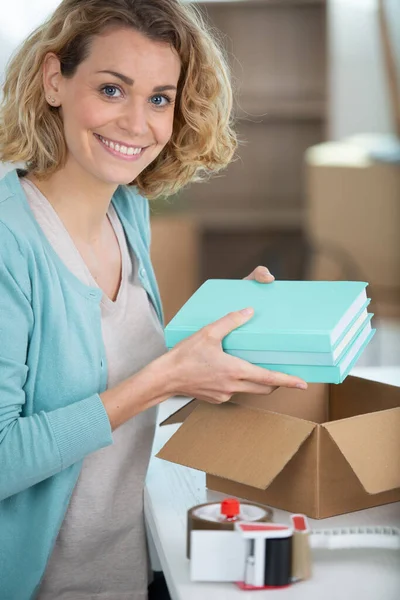 Young Girl Taking Books Out Box — Stock Photo, Image