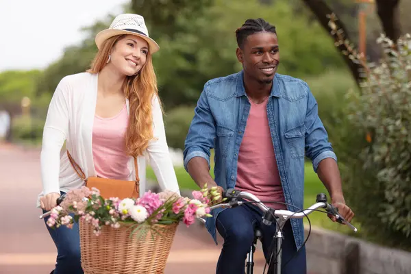 Young Couple Riding Bike Park Taking Flowers Home — Stock Photo, Image