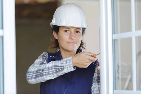 Woman Builder Screwing Window Frame — Stock Photo, Image