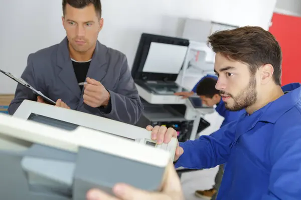 Young Male Technician Repairing Digital Photocopier Machine — Stock Photo, Image