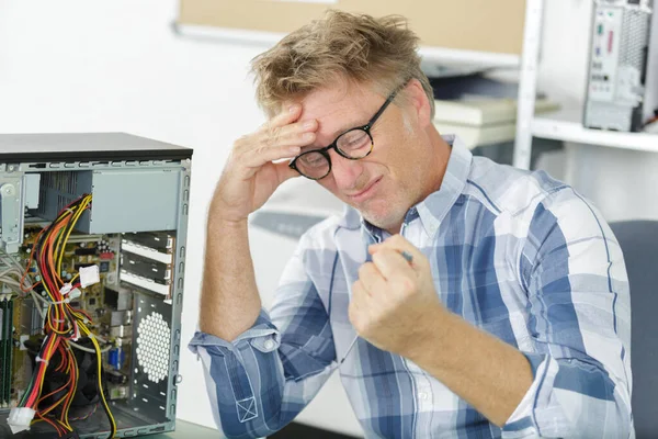 angry and annoyed computer repairman