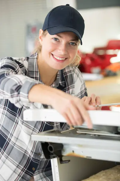 a smiling female handyman working