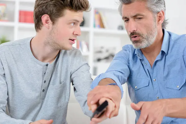 Two Men Fighting Remote Control — Stock Photo, Image