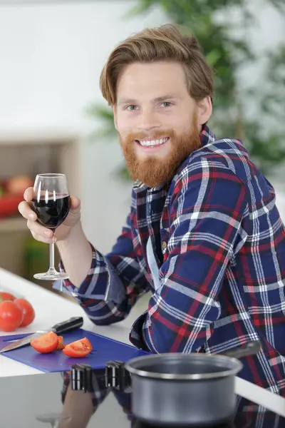 Man Drinking Glass Wine While Cooking — Stock Photo, Image
