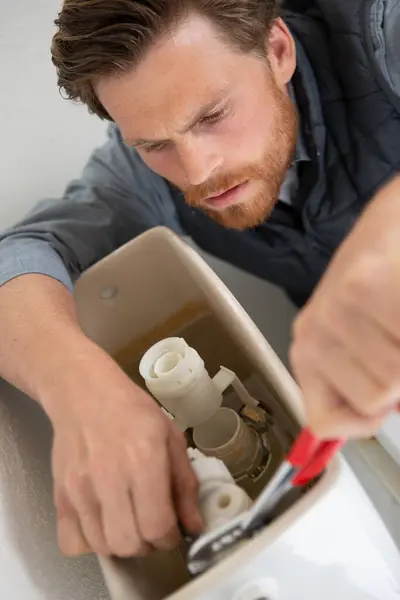 Plumber Repairing Toilet Cistern Water Closet — Stock Photo, Image