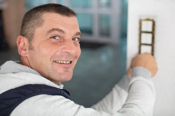 Male Electrician Working Triple Light Switch — Stock Photo, Image