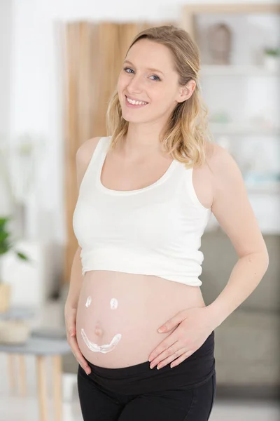 Close Pregnant Belly Cream Heart — Stock Photo, Image
