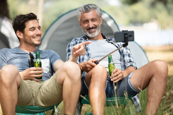 happy men enjoying outdoor party