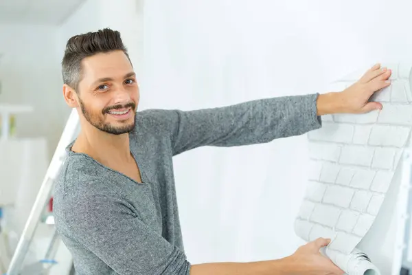 Man Testing Wall Paper Wall — Stock Photo, Image