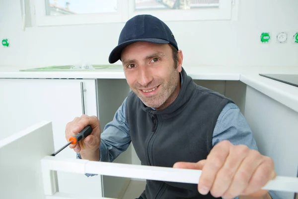 Happy Man Screwing Screws Furniture Fittings — Stock Photo, Image
