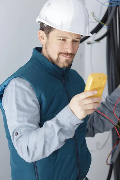 Electrician Measuring Voltage Distribution Board — Stock Photo, Image
