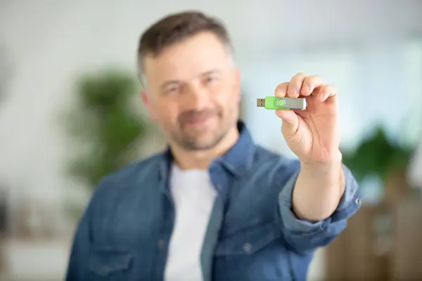 Blurry Man Holding Memory Stick — Stock Photo, Image