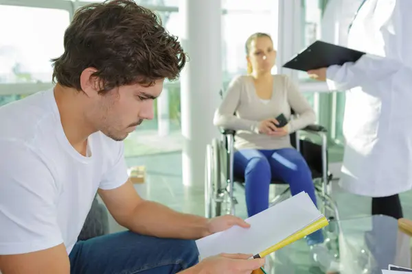 young man in hospital waiting area